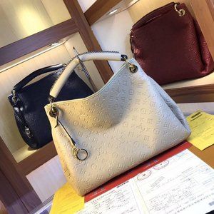 LV Artsy MM Monogram Empreinte Leather in White